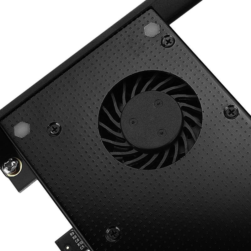 A black computer fan, installed in a metal housing and secured by screws. The fan provides cooling within a computer case.