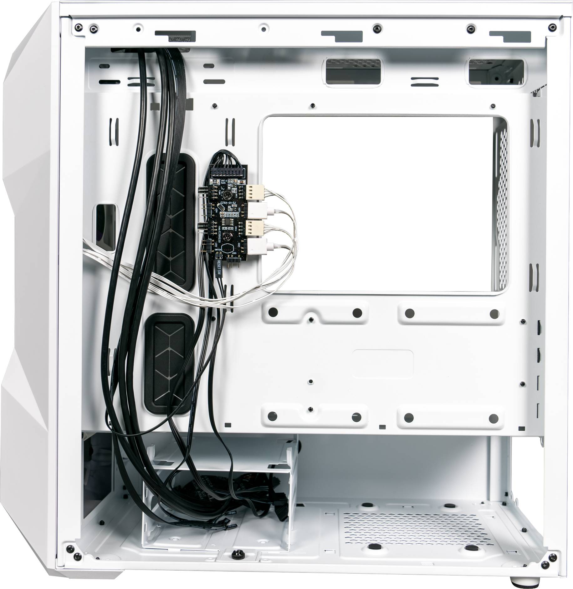 'Interior view of a white computer case with mounted cables and an installation board. Plenty of space for additional hardware.'