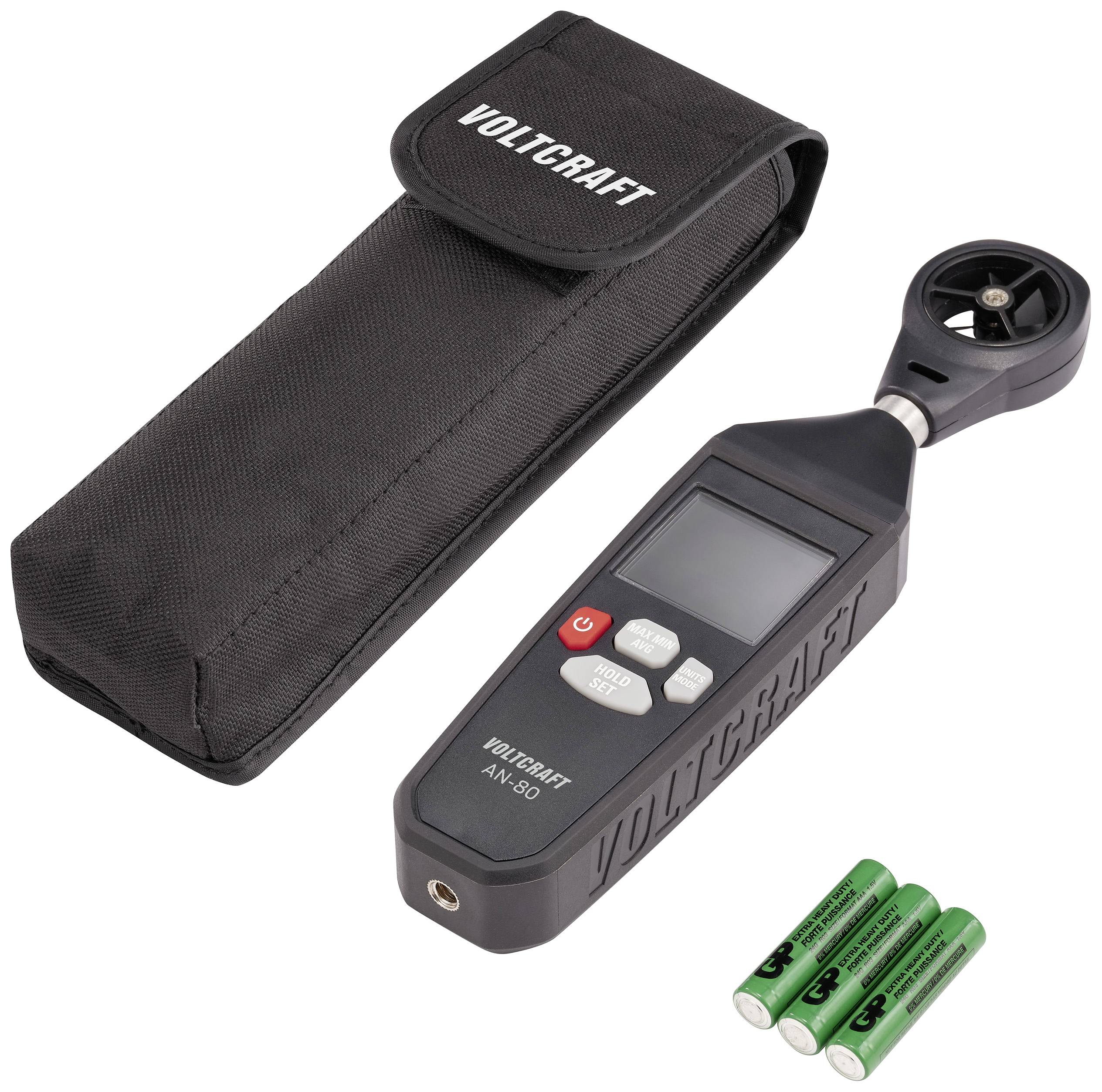 Digital anemometer with digital display, button controls and a small propeller on the top, alongside a carry case and three batteries.