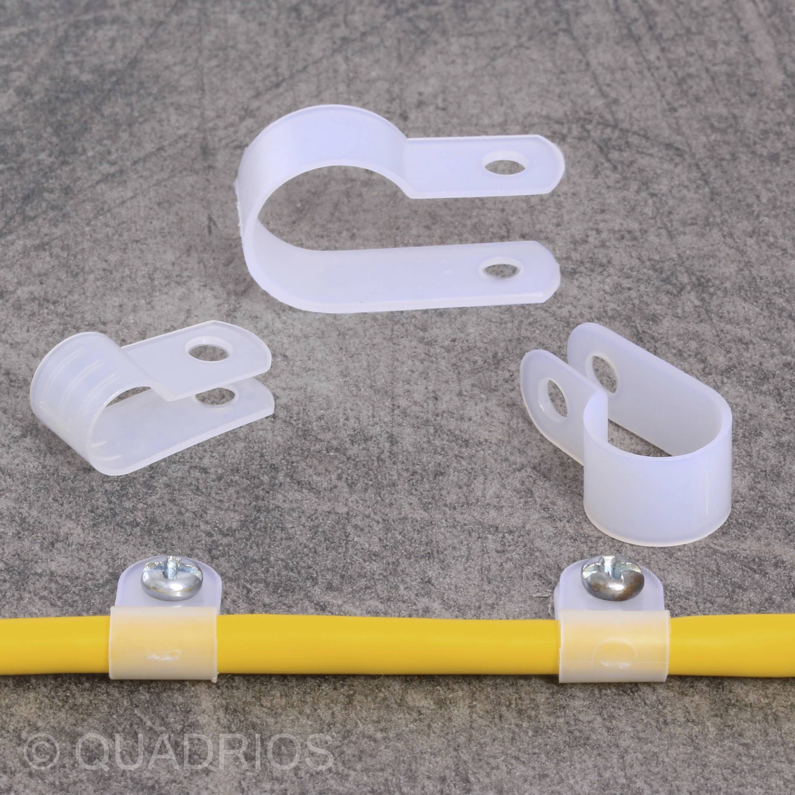 Plastic cable clips hold a yellow cable in position. The clips are arranged on a grey background.