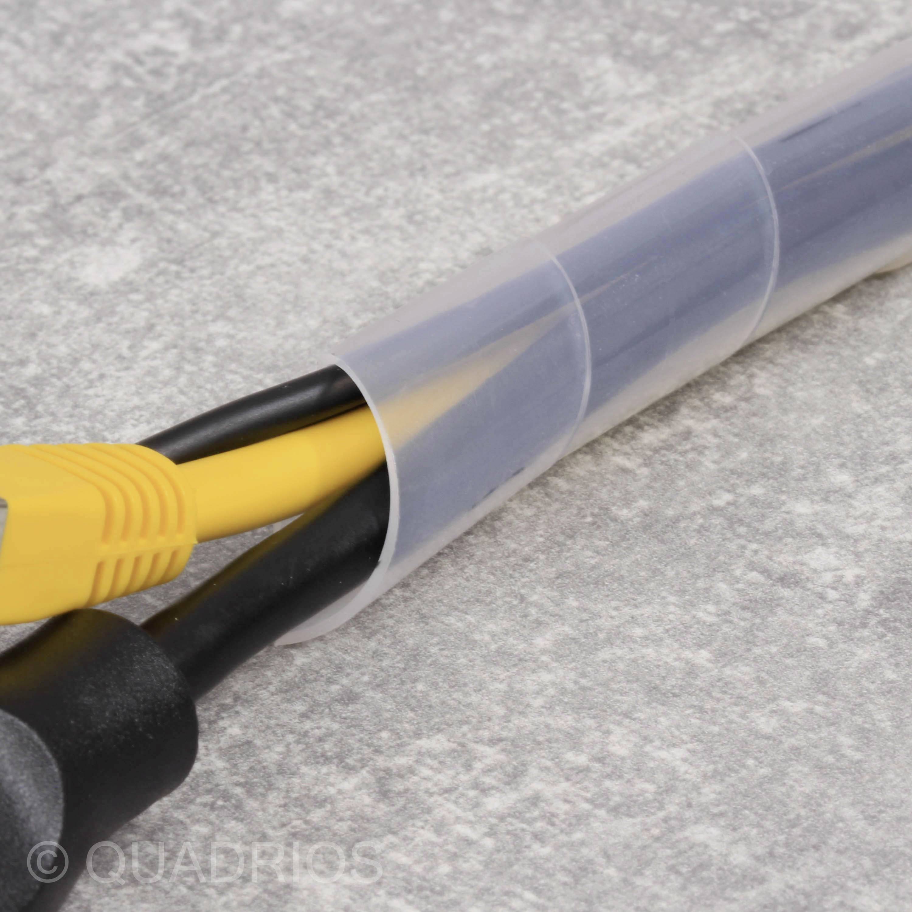 A bundle of cables, including a yellow Ethernet cable, are organised in a transparent cable trunking.