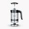 Electric milk frother in stainless steel with removable lid and whisk, switch and handle visible, by Severin.