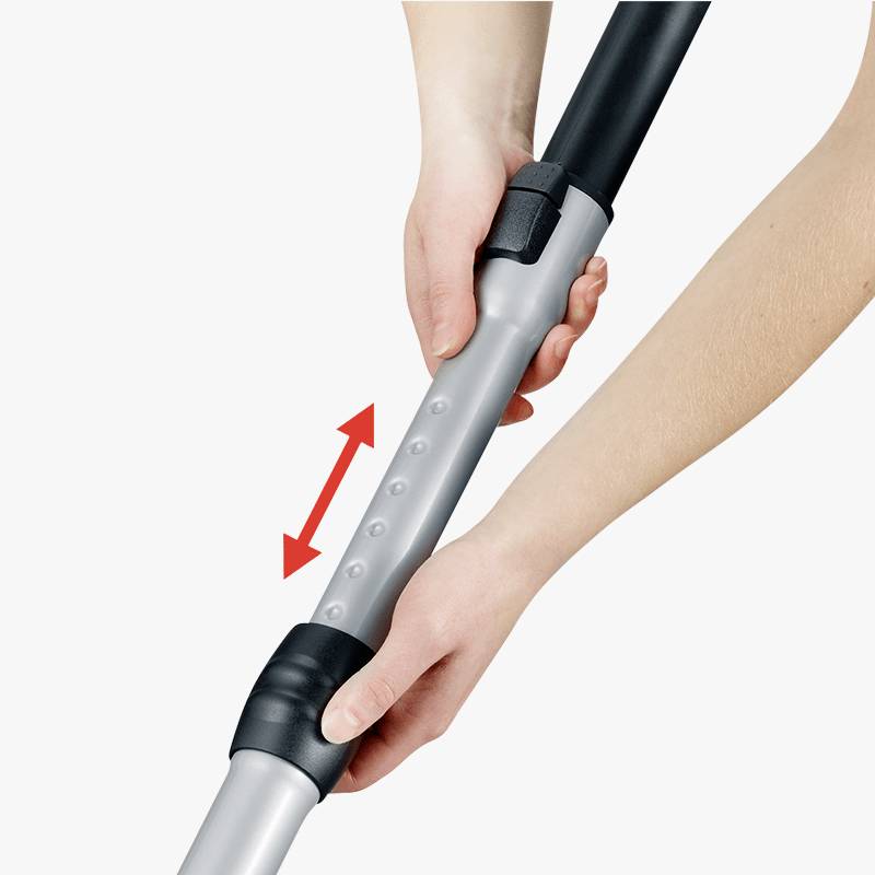 A hand grips a telescopic pole, while the other hand pulls it out. A red arrow indicates the direction of movement.