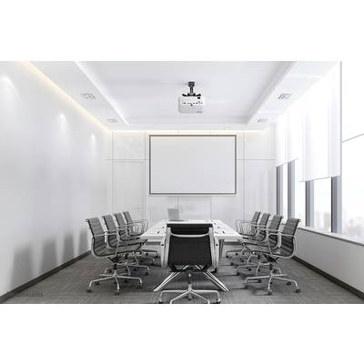 A modern conference room with a large table, several empty swivel chairs, a projector, and a screen on the wall.