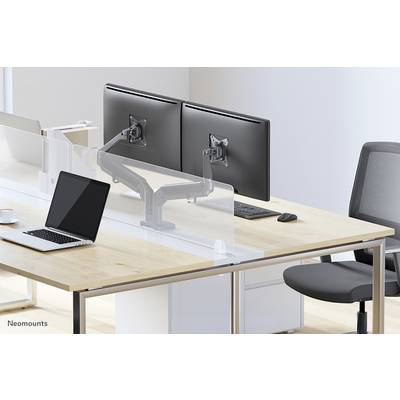 A workstation with two monitors on an adjustable arm, a laptop, a keyboard, and an ergonomic chair.