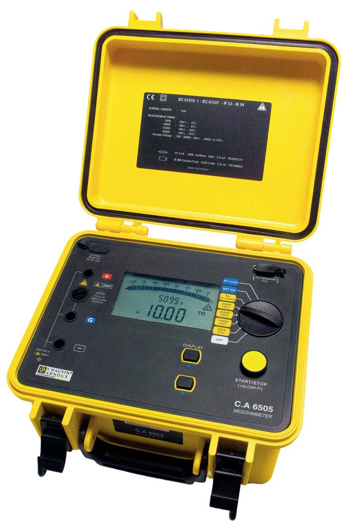 A yellow electrical testing device model C.A 6505 with an open lid. The screen displays various measurement values and operation buttons.
