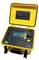 A yellow electrical testing device model C.A 6505 with an open lid. The screen displays various measurement values and operation buttons.