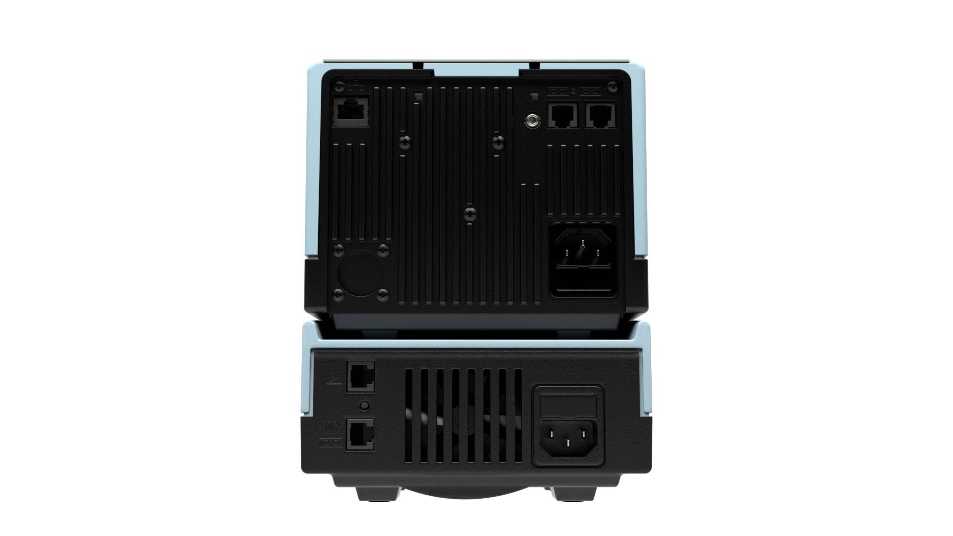 Rear view of a technical device with multiple connection ports and ventilation slots. Network interfaces and power connection are visible at the top.