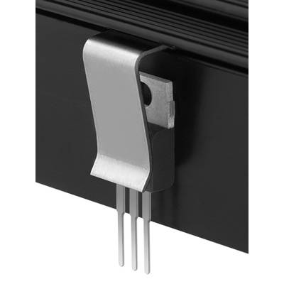 A metal clip on a black casing, holding three pins. Technical component focusing on connection and stability.