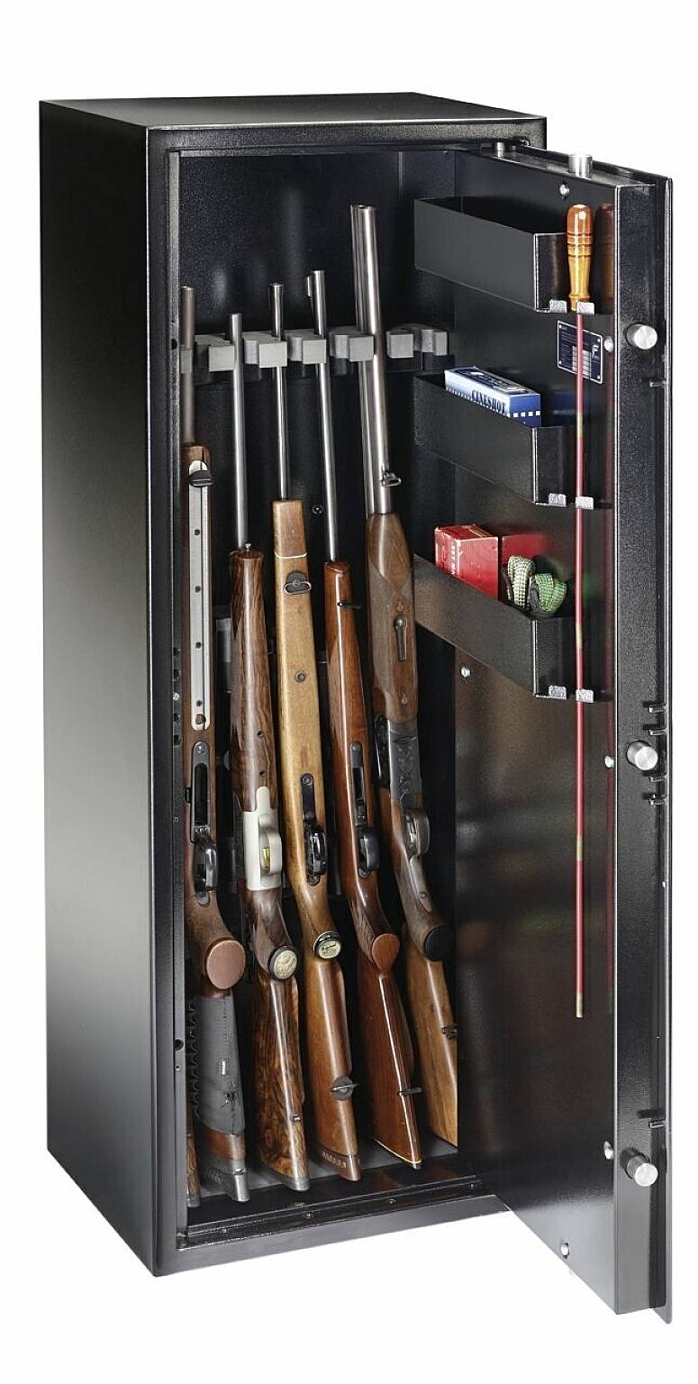 An open gun cabinet displays several rifles standing inside, along with accessories such as cleaning rods and ammunition boxes.