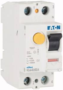 A white RCD (Residual Current Device) with a black lever and yellow test button. The 'EATON' logo is displayed at the top. Numerous technical details are present.