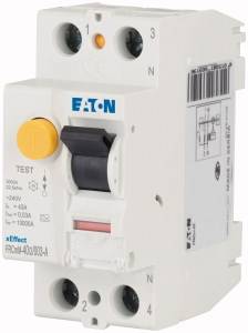 A white Eaton residual current device (RCD) with blue text and a yellow test button lies on a white background.