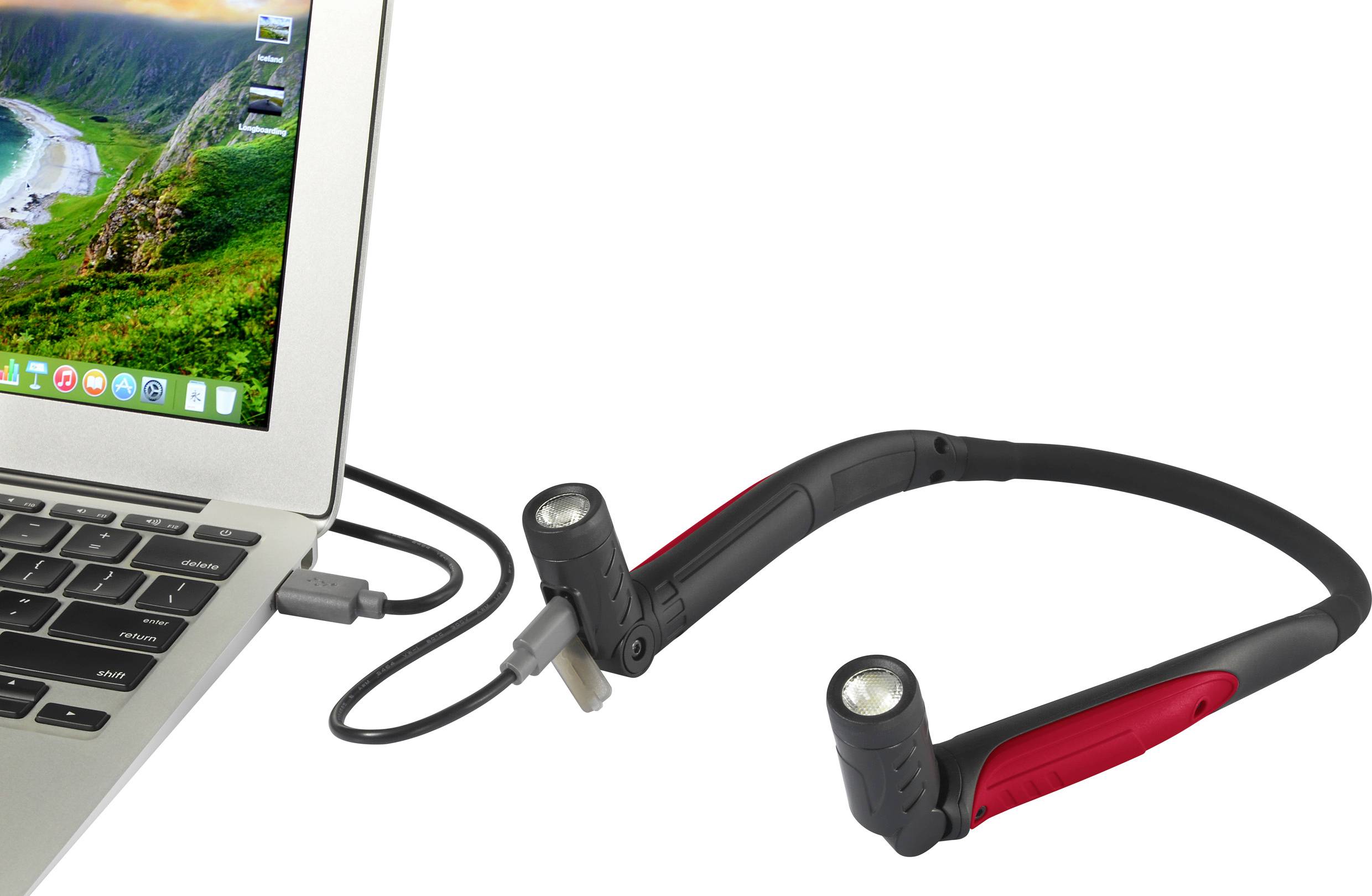 A laptop is connected to a flexible LED reading lamp via a USB cable. The screen displays a landscape.