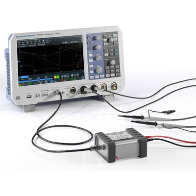A oscilloscope with connected test leads shows a waveform and measurement data on the screen.