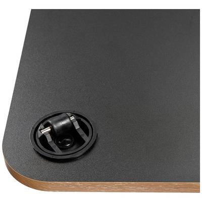 Black tabletop with a rounded corner and black cable grommet in the corner; wooden layer visible at the edge.
