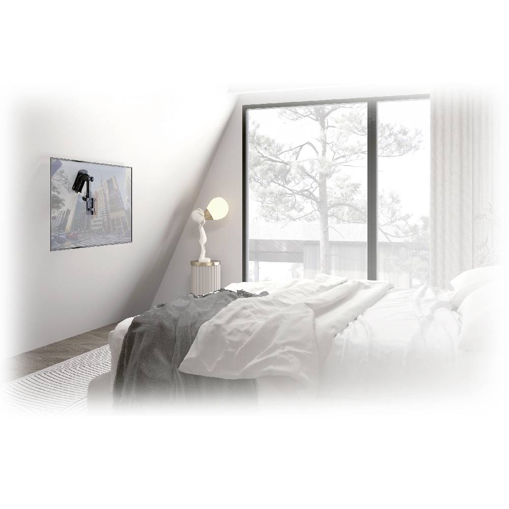 Modern bedroom with a large window offering a view of trees. Cosy bed with white bedding, picture on the wall.