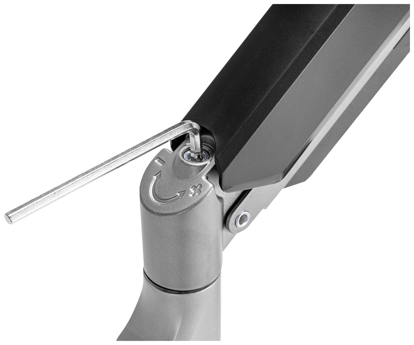 An Allen key adjusts a metal screw on a hinge. The image shows the mechanism for fine-tuning a joint.