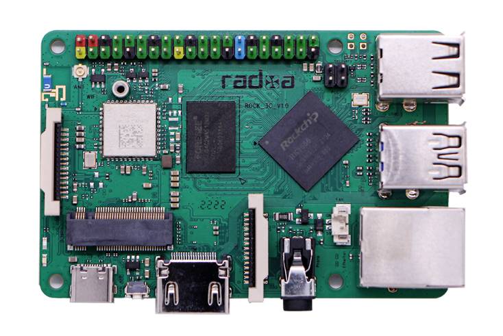 A green printed circuit board module with multiple connectors and chips displays the central processing unit and connection possibilities.