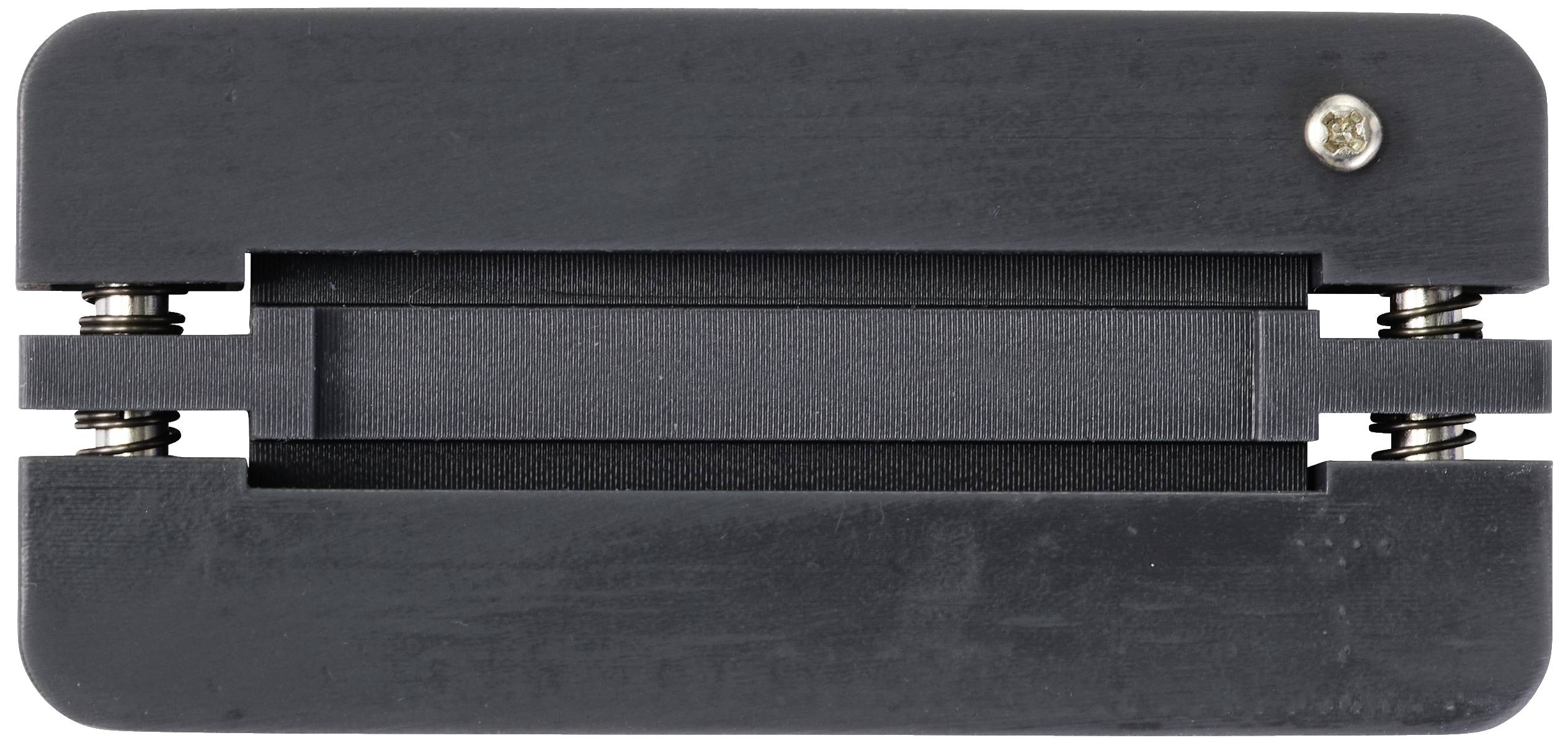 A rectangular black component with two visible screws at the corners. It has a central opening, likely for electronic connections.