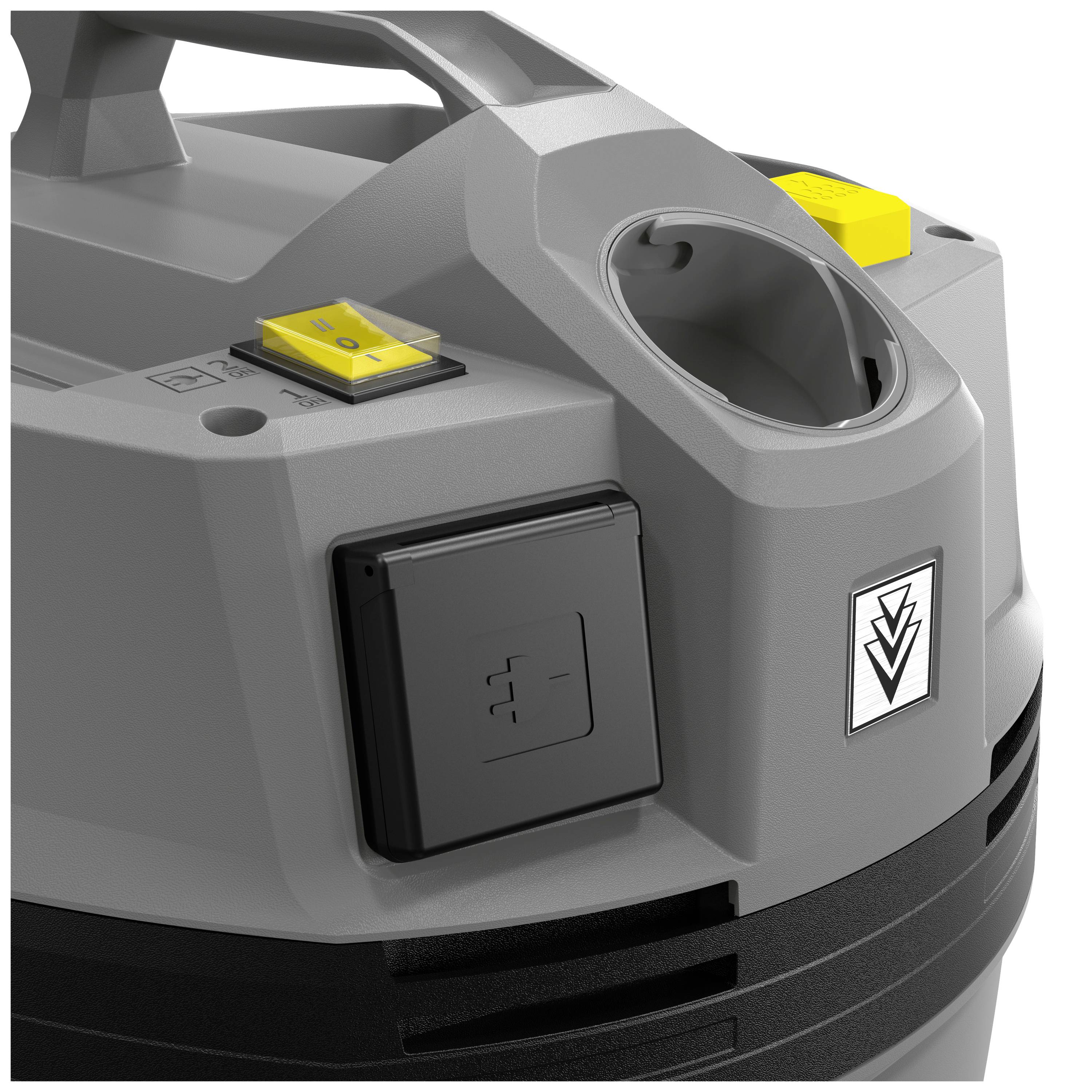Grey and black workshop vacuum cleaner with yellow buttons, carrying handle, and socket on the top surface.