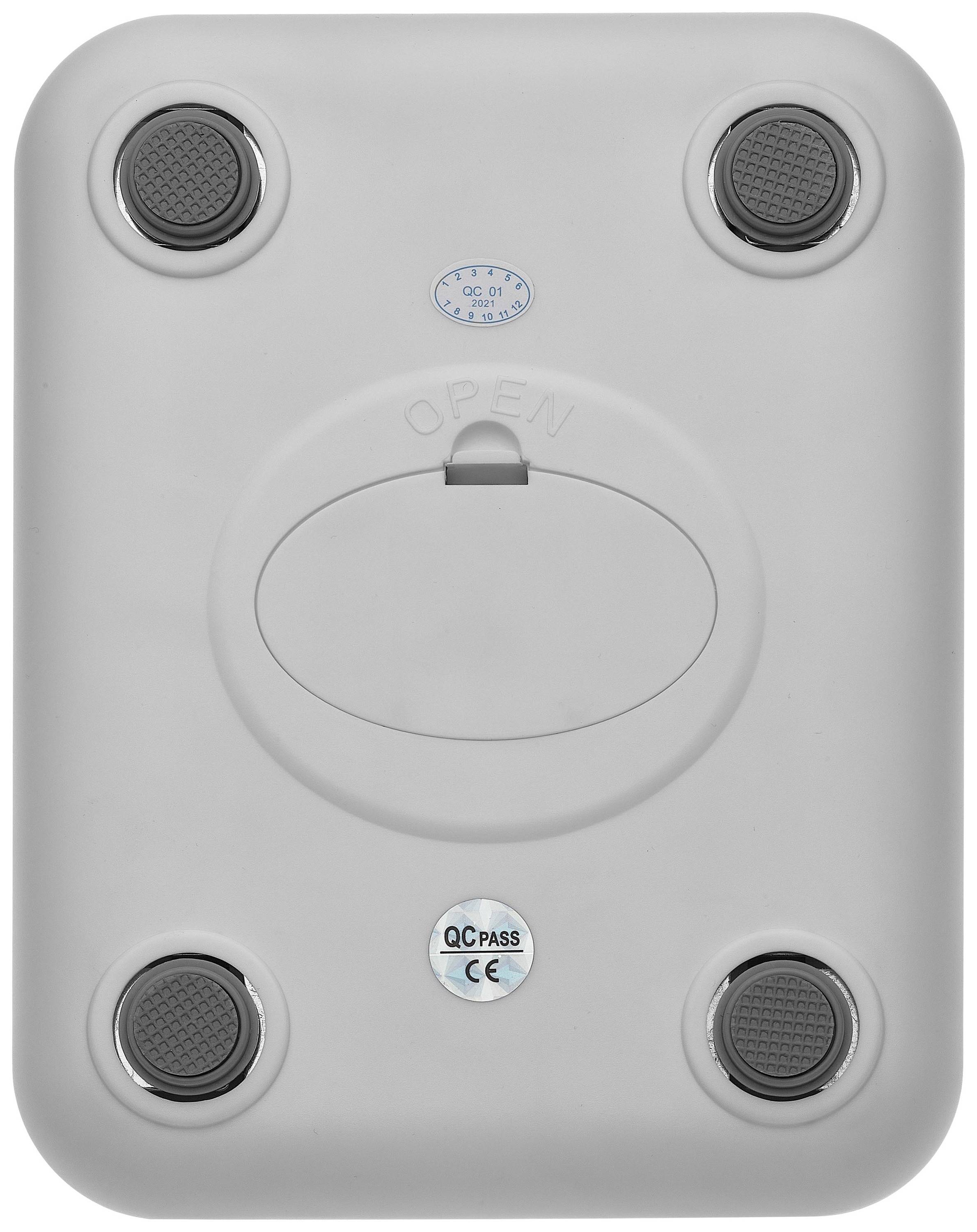 Grey electrical device with a circular opening in the centre and four non-slip feet at the corners. Brand mark and 'QC PASS' seal visible.