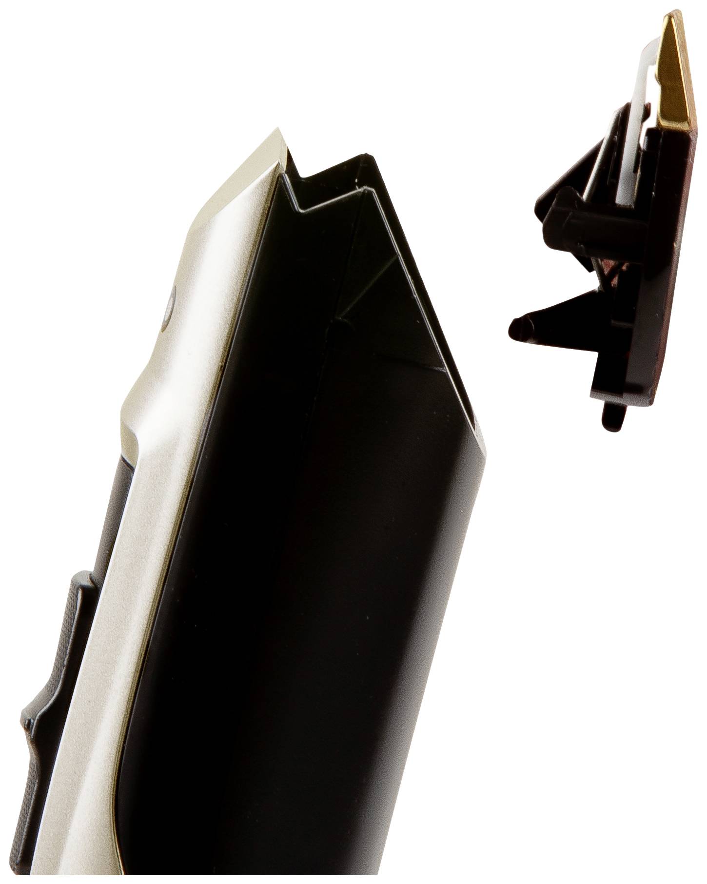 An electric razor with a detached cutting head hovering to the right of the device.