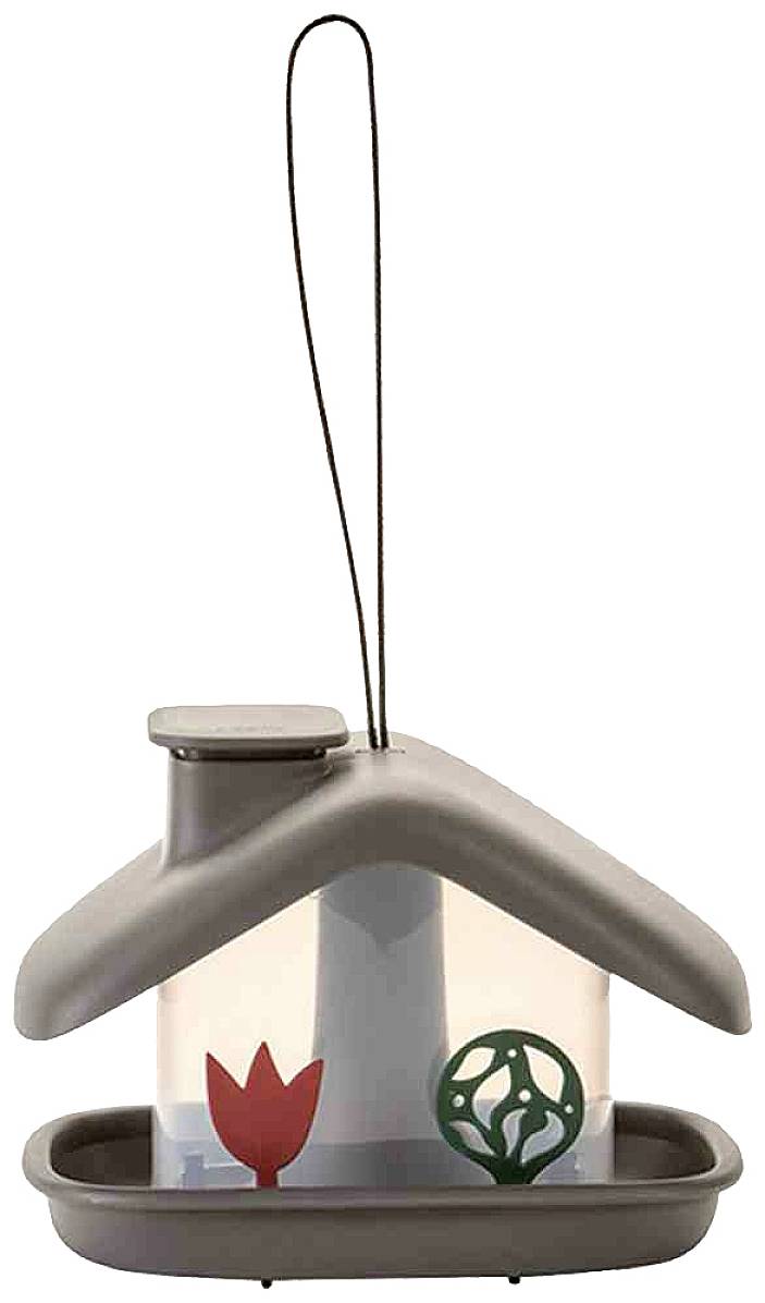 A small, stylised bird house pendant with a grey roof. Decorative red and green shapes inside.