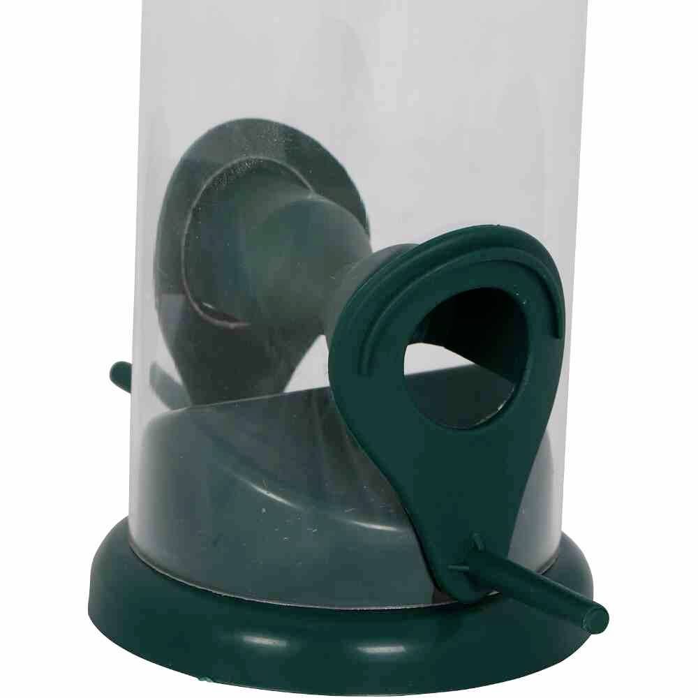 Transparent feed silo with green perches for birds.