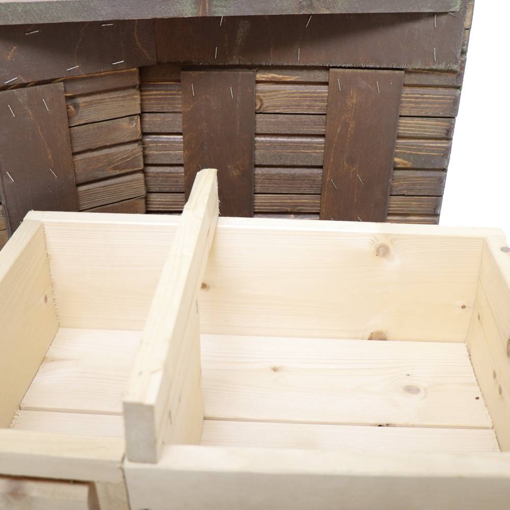 Wooden shelving unit under construction, showing a partially assembled structure with unjoined boards and an insert. Signs of skilled craftsmanship.