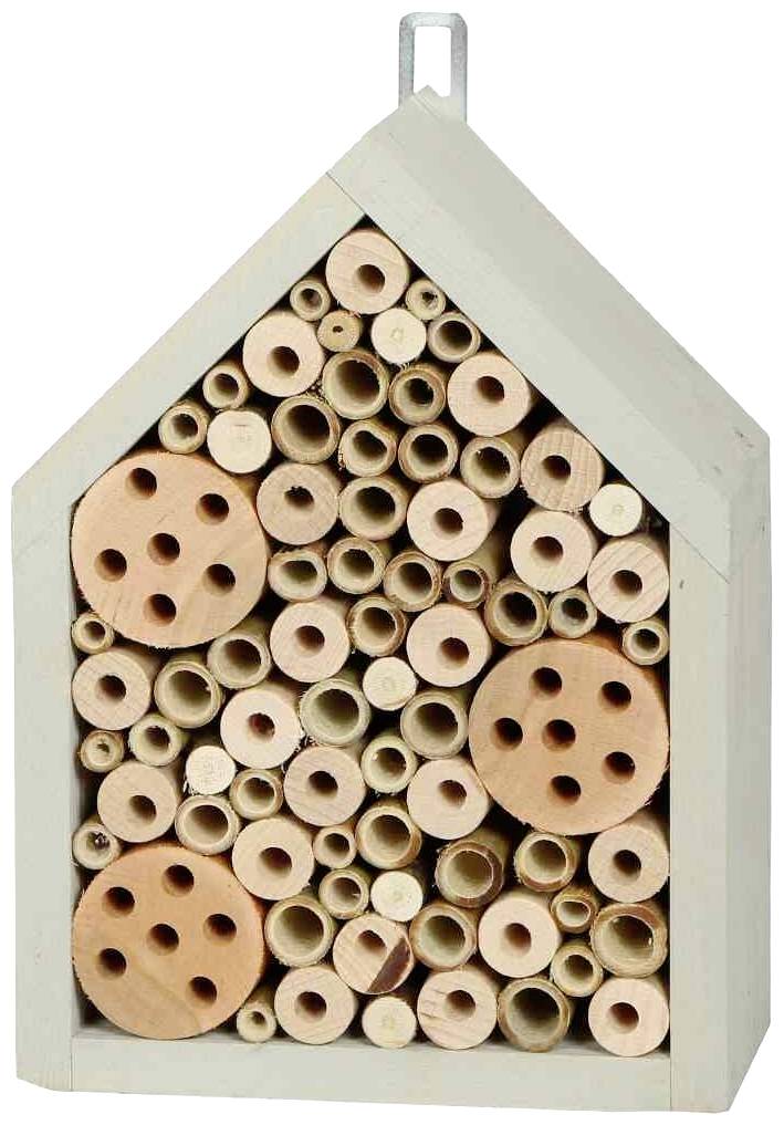 A wooden insect hotel with various tubes and holes that serve as a shelter for bees.