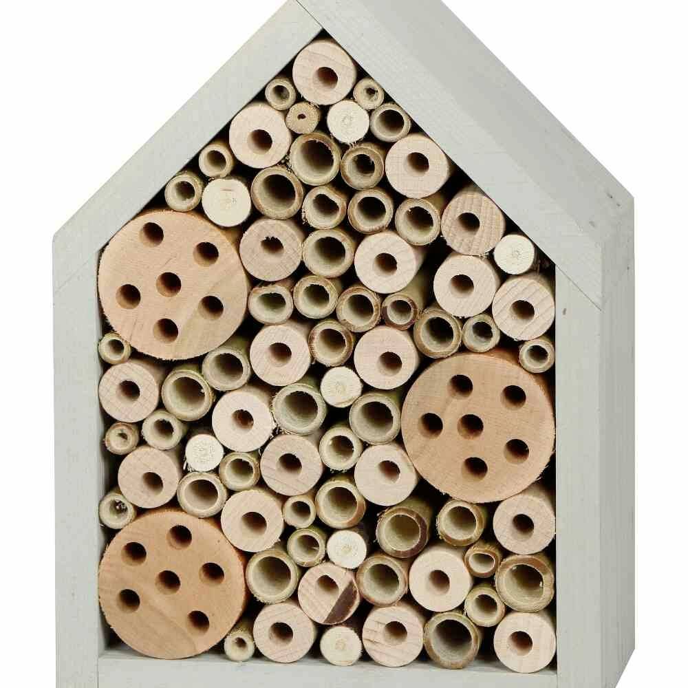 'Wooden and bamboo insect hotel in a house shape, consisting of tubes and holes, designed to support wild bees and other insects.'