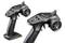 Two black RC remote controls with steering wheels and control elements on the top surface, suitable for model cars.
