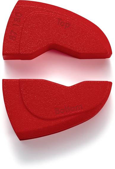 Two red, curved foam pieces with the labels 'Top' and 'Bottom', which fit together, are lying side by side.