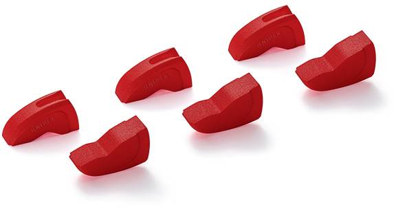 Six red brake pads from a side view; four upright and two overturned.