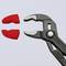 A black pair of pliers with red, removable plastic protective jaws is lying on a grey background.