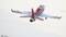 A model aircraft in red and white, with the inscription 'Viper Jet', is flying in the air.