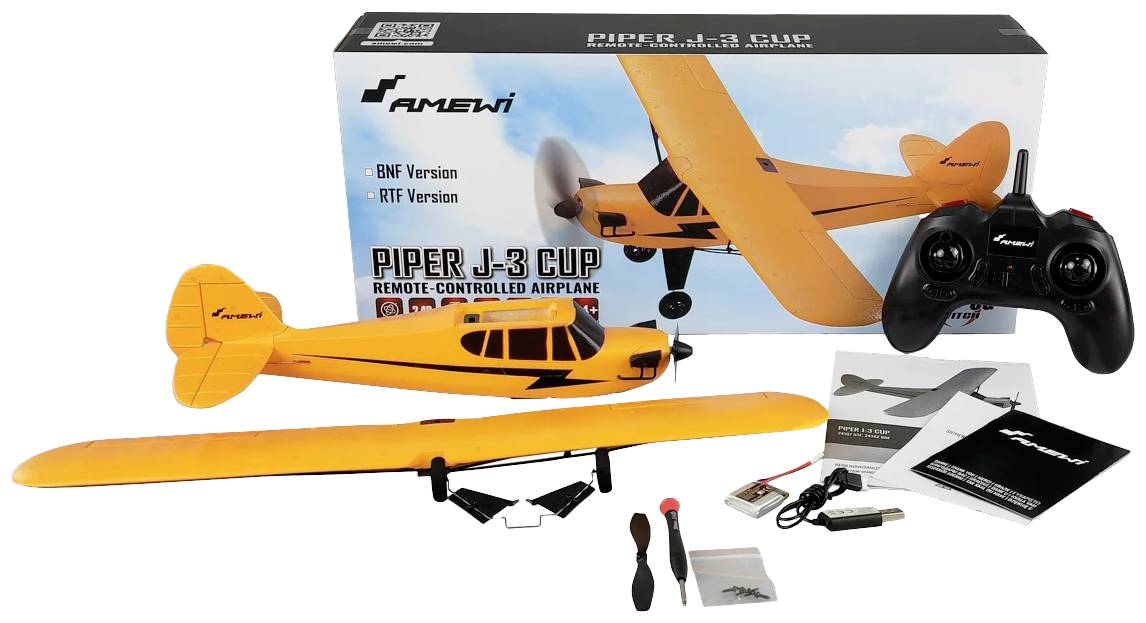 Remote-controlled model aircraft 'Piper J-3 Cub' in orange, with remote control and accessories such as propeller and instructions in front of the packaging.