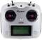 White radio remote control with two joysticks, six toggle switches and LCD screen, marked with 'Amewi G921H'.