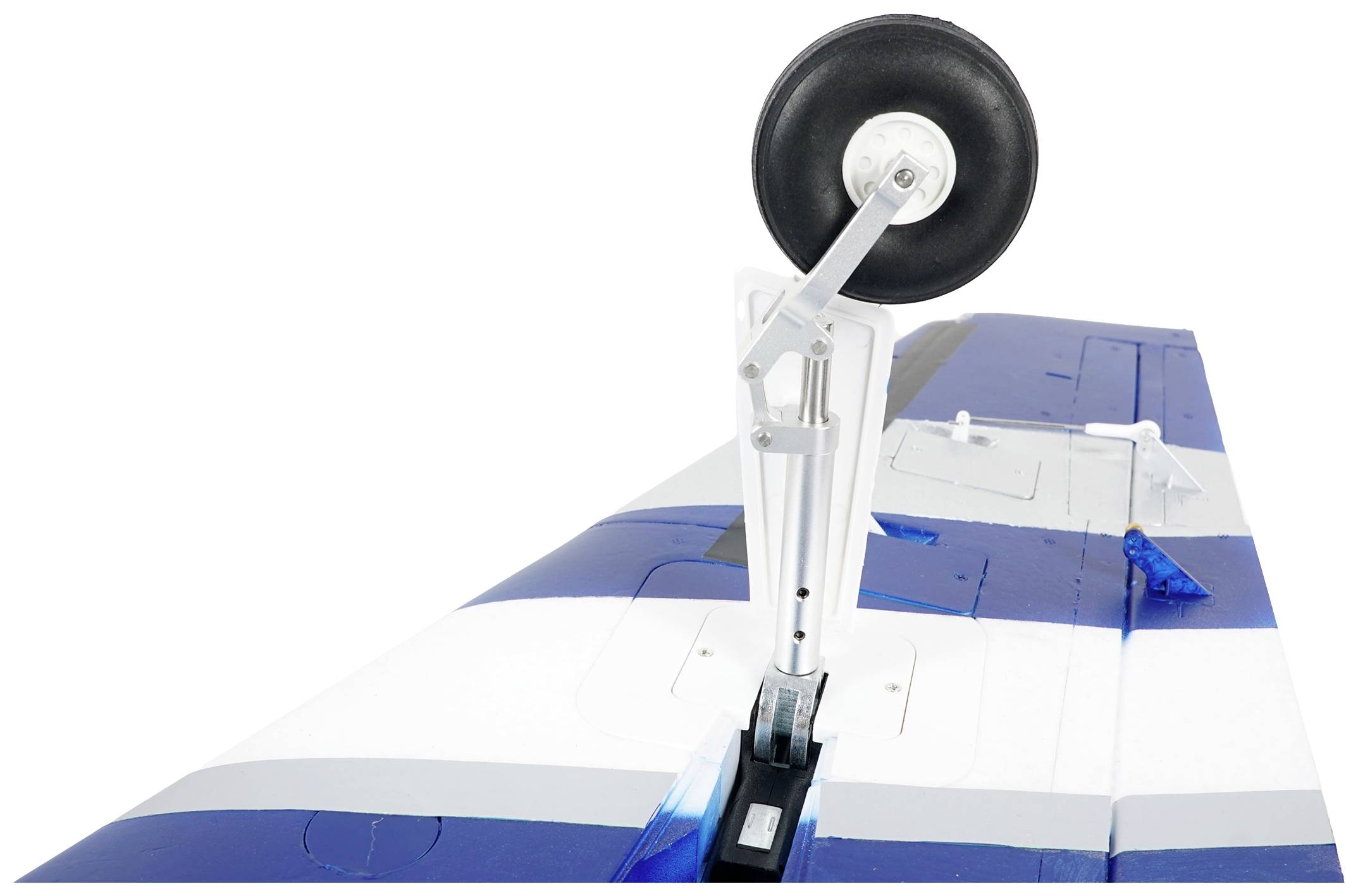 Model aircraft rudder in blue and white with visible landing gear.