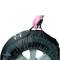 A hand is holding a black wheel cover with a tyre, on which a trade crate is depicted.