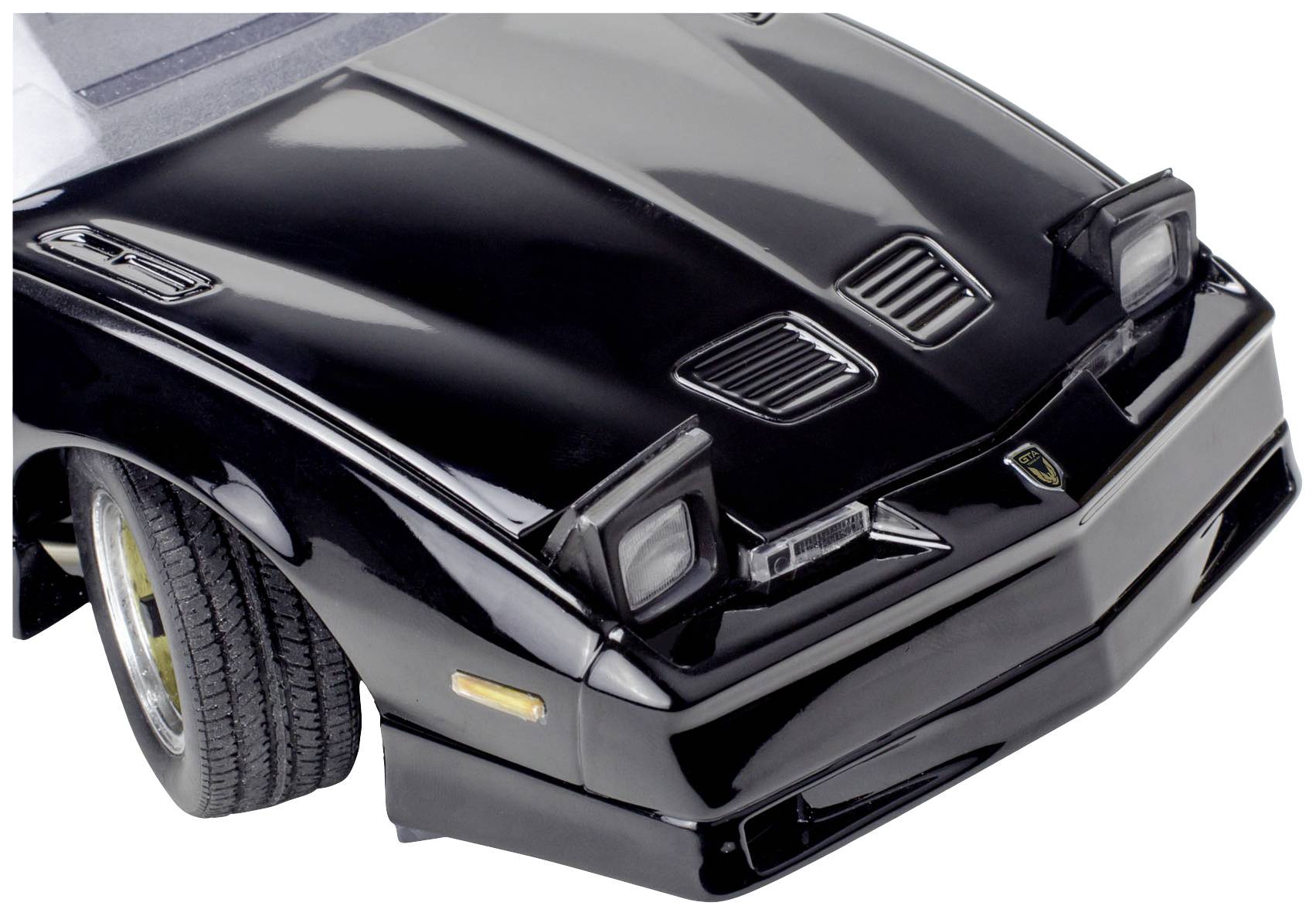Black toy car, front view. Twin headlights visible, aggressive sports car design.