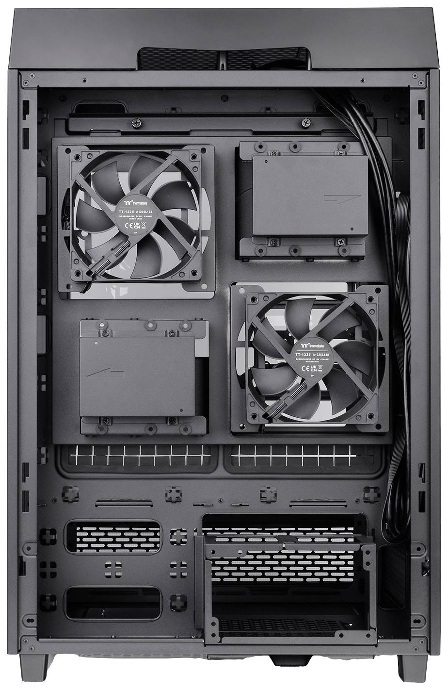Computer case with two fans at the top and in the middle, power supplies and cables inside.<br><br>Translation note: The translation is in British English and maintains the original description of the computer case and its internal components.