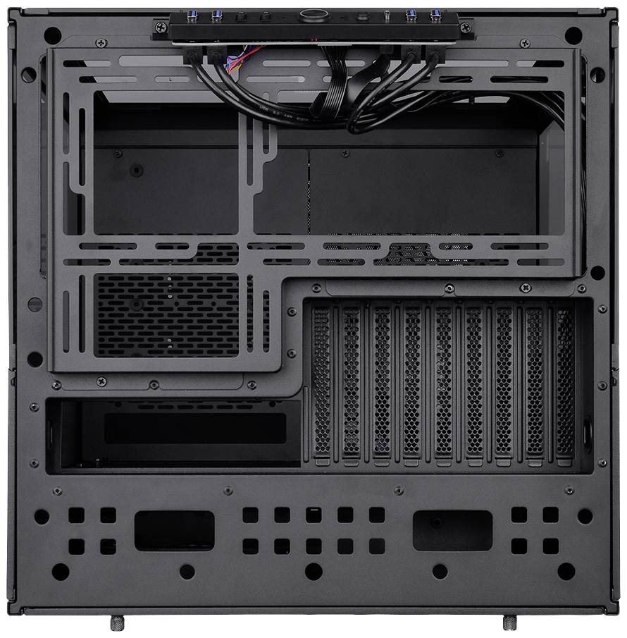 Computer case interior, showing various mounting spaces for hardware components, ventilation slots, and cabling options.
