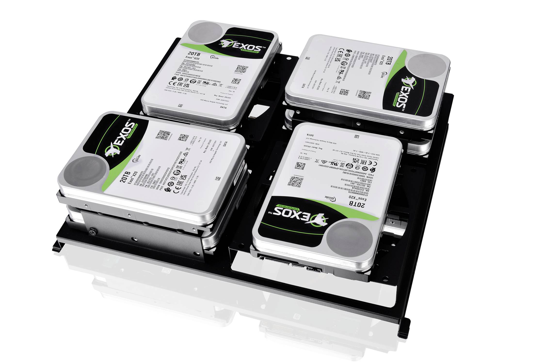 Four internal hard drives in a mounting frame, all bearing the brand name 'Exos'. Each hard drive is similarly designed.