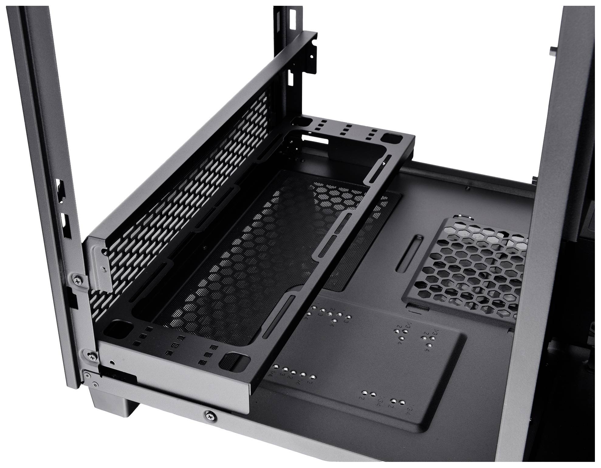 Computer case with an open drive bay and visible honeycomb structure for ventilation. The focus is on the internal structure.