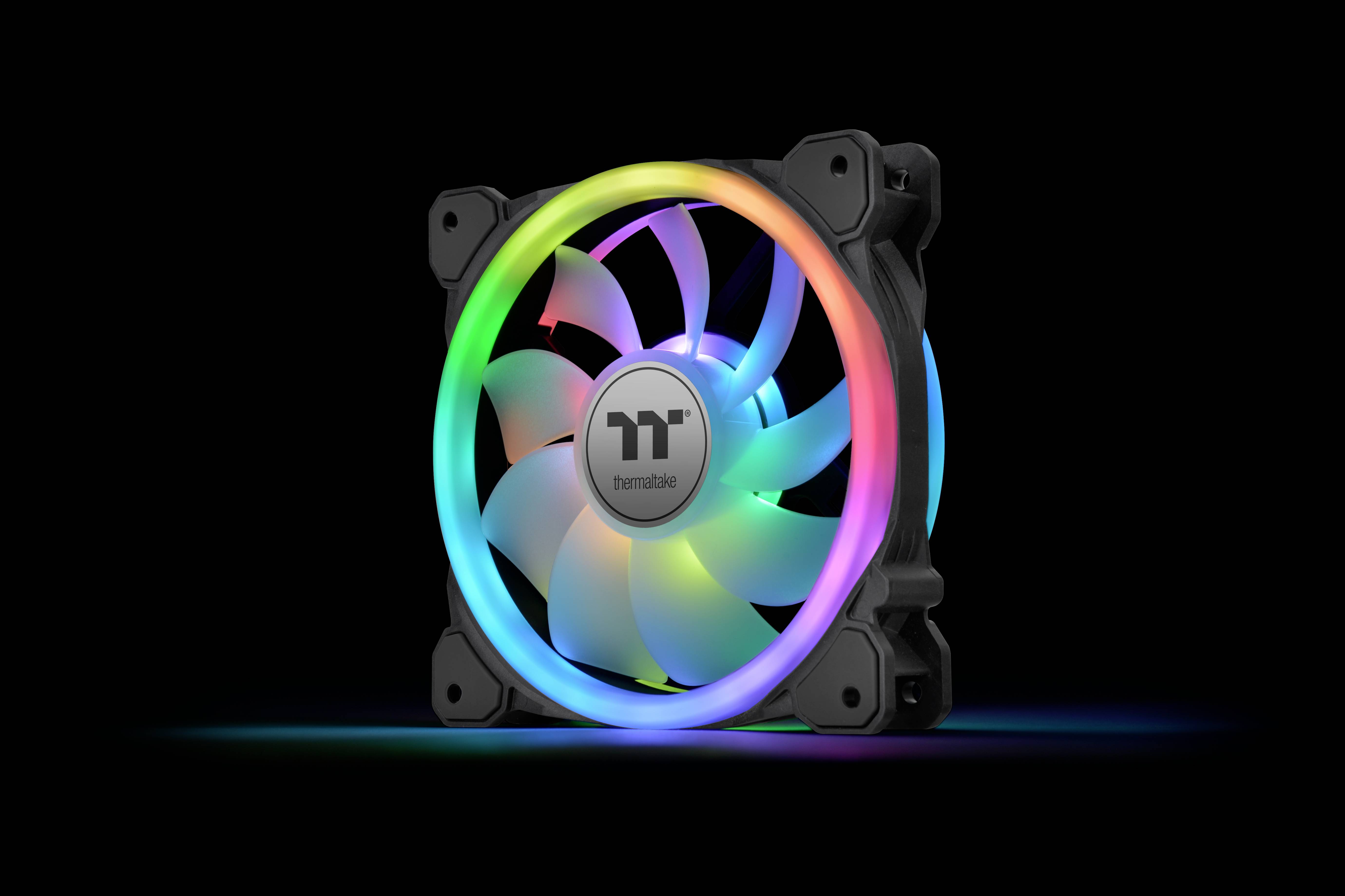 A computer case fan with colourful LED lights glowing in rainbow colours, against a black background.