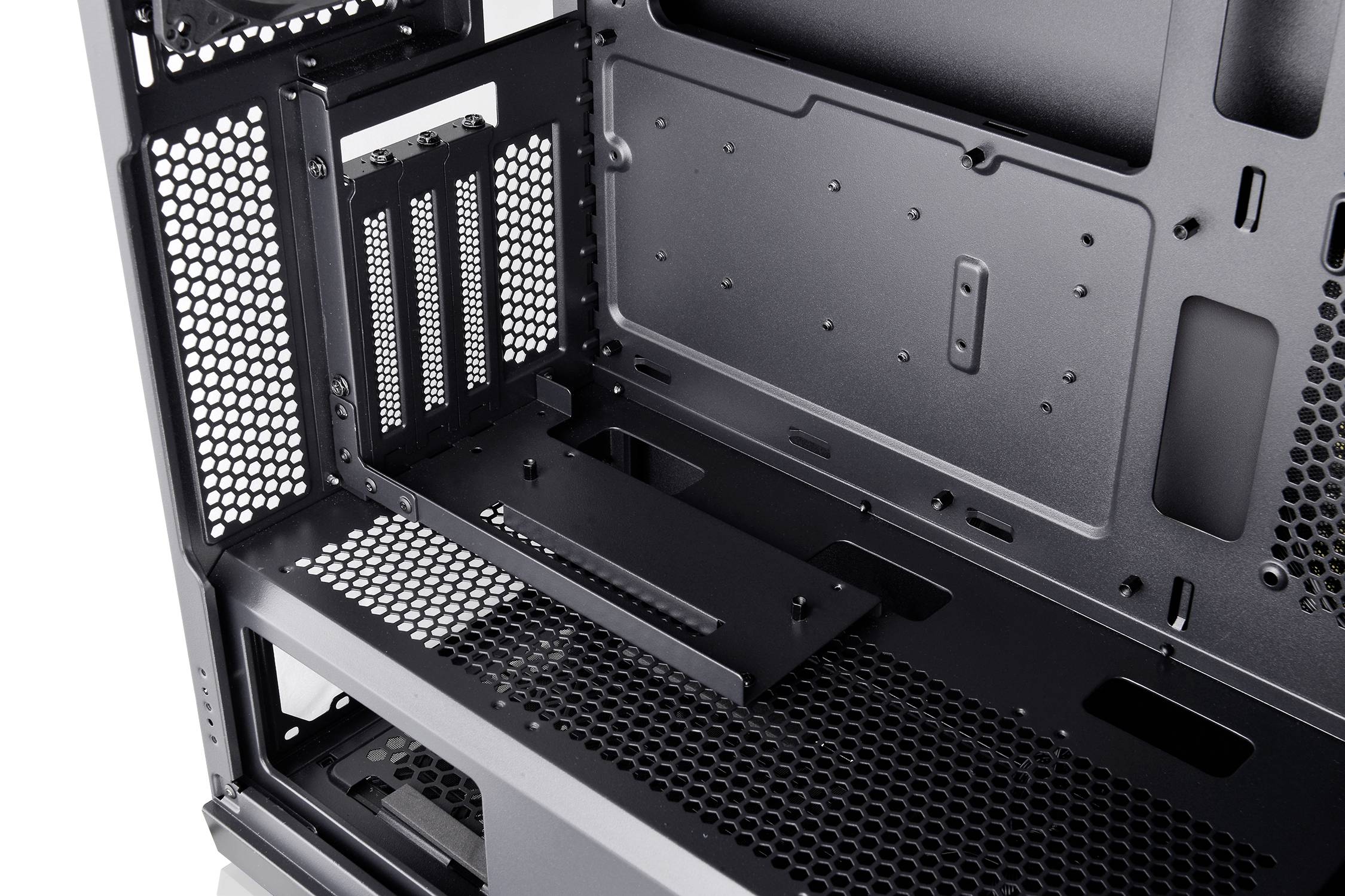 Interior view of a computer case with multiple fan and expansion slots.
