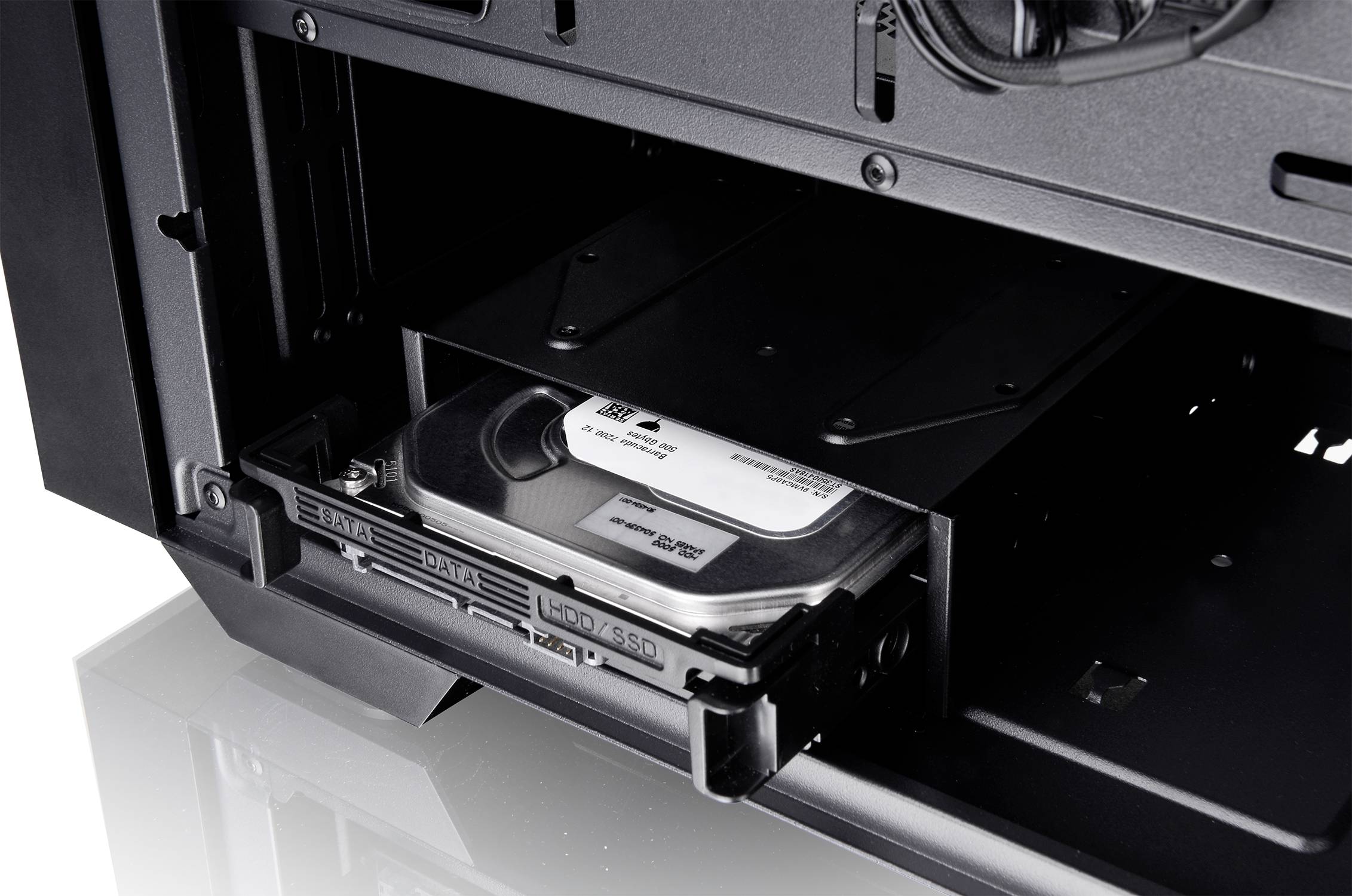 Internal hard drive is mounted on a tray inside a computer case, ready for use.