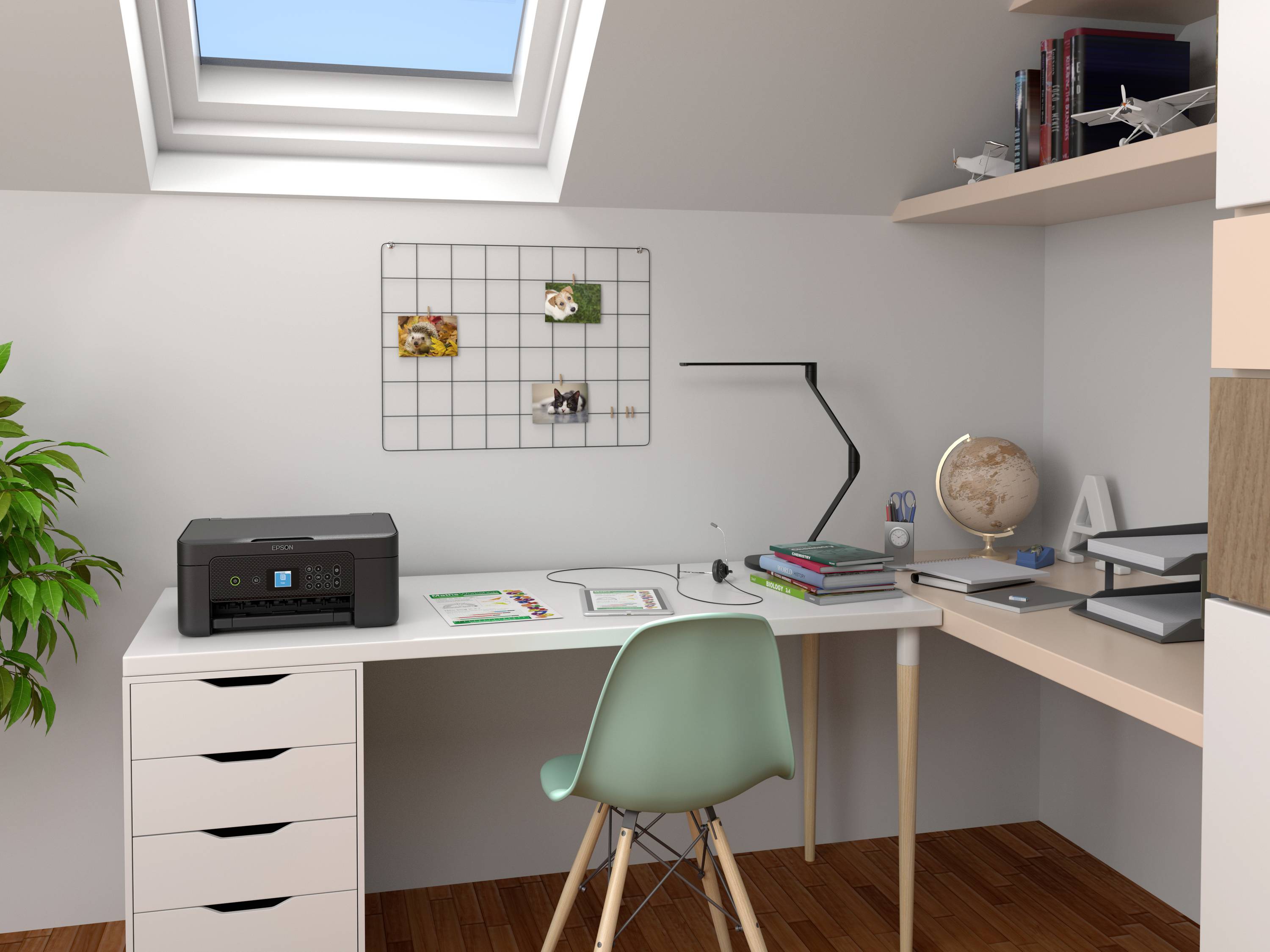 A tidy desk beneath a roof window, featuring a printer, chair, globe, and plants. Shelves with books and models.