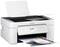 A white multifunction printer is printing a coloured document with graphics and diagrams.